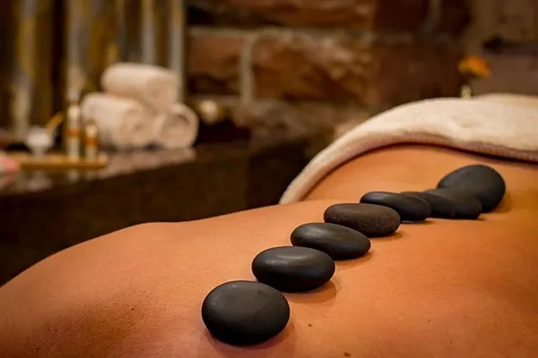 Heated stones used to relieve muscle tension and improve circulation