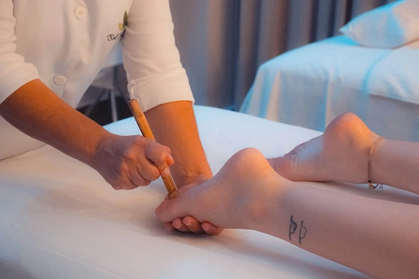 Certified male therapist performing authentic Thai stretching and acupressure massage in Noida.