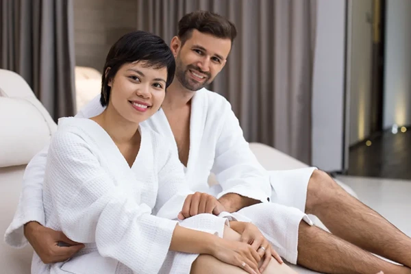 Private male-to-male couples massage session in a discreet and comfortable spa environment.