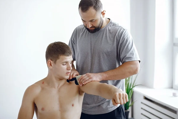 Professional male massage equipment including hypoallergenic organic oils and portable massage table for home service.