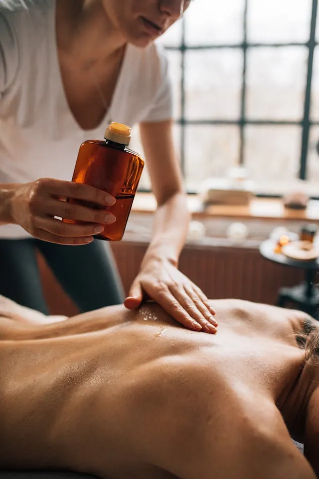 A professional male-to-male massage session helping an urban professional recover from city stress and pollution.