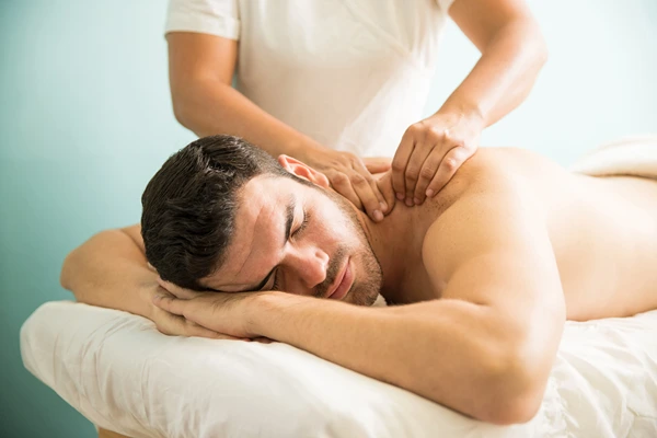 Balinese massage featuring skin rolling and pressure point work for men in Noida.