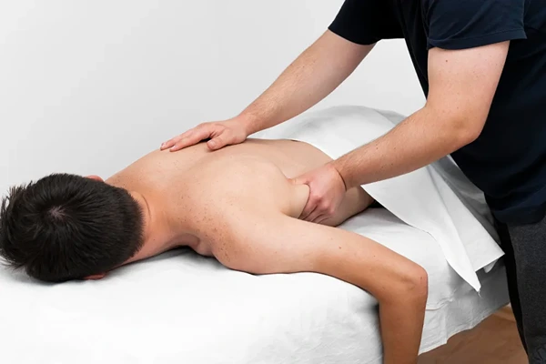 Professional sports massage for muscle recovery and performance in Karol Bagh.