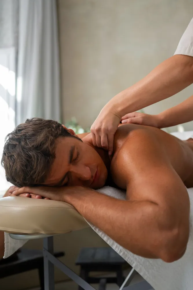 Professional male massage therapist providing hygienic customized full body massage therapy for men